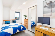 Bedrooms with desks and storage